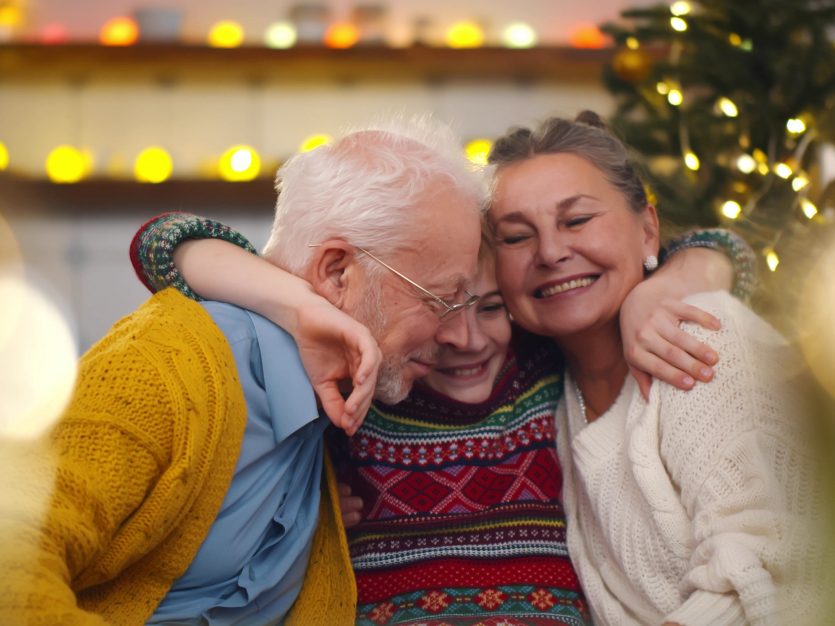 Gifts for seniors - Family hugging and smiling