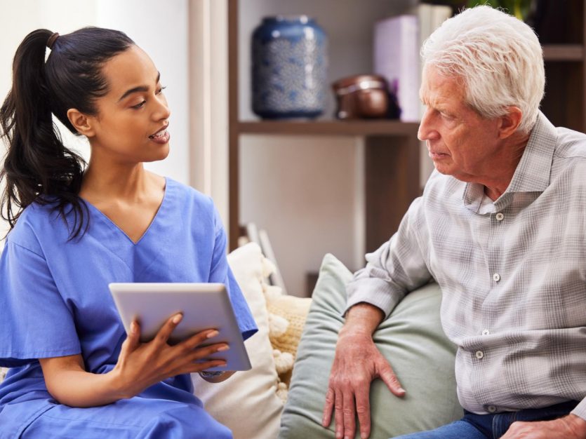 Nurse talking to senior