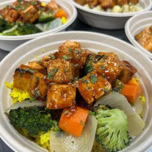 Sweet and sour tofu accompanied by various vegetables.