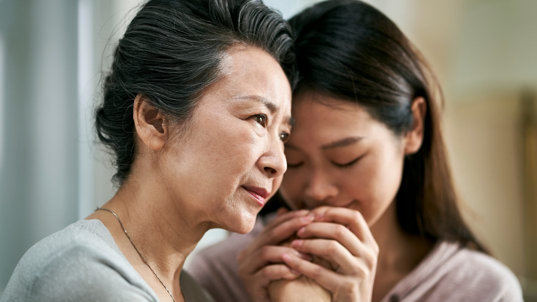 Asian daughter with senior mom with dementia