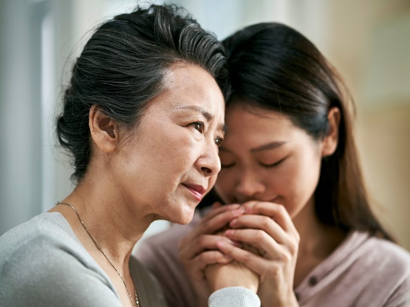 Asian daughter with senior mom with dementia