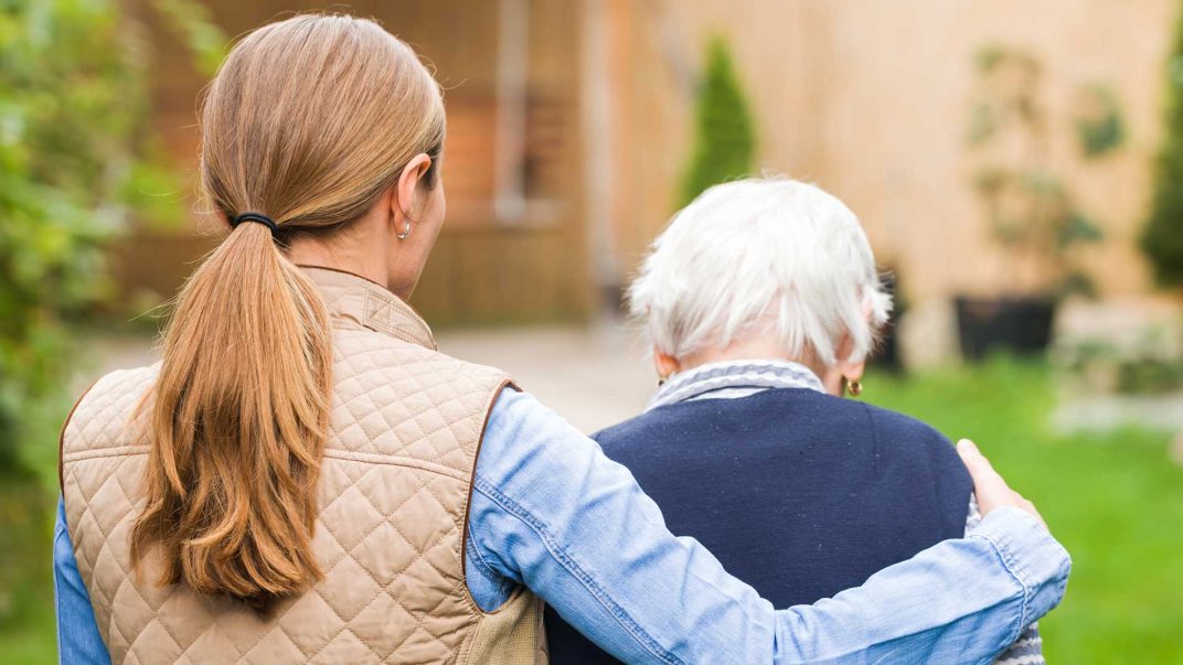 Helping the helpers: Easing the burden on caregivers 1 caregiver and seniors walking outside