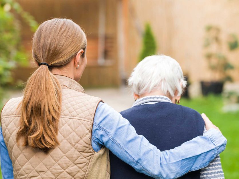 Helping the helpers: Easing the burden on caregivers 2 caregiver and seniors walking outside