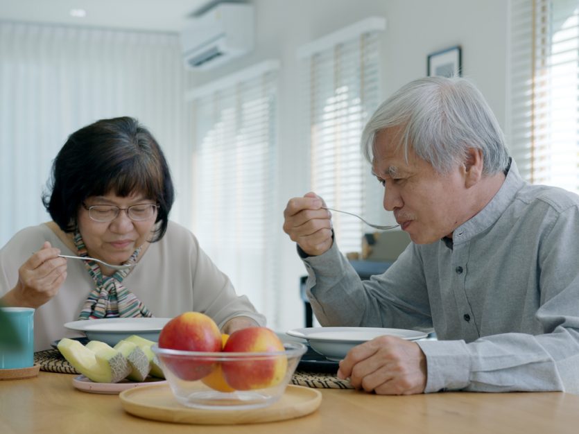 Living with prediabetes or type 2 diabetes? 3 areas to consider! 6 Older adult couple sitting at their dining room table and eating soup.