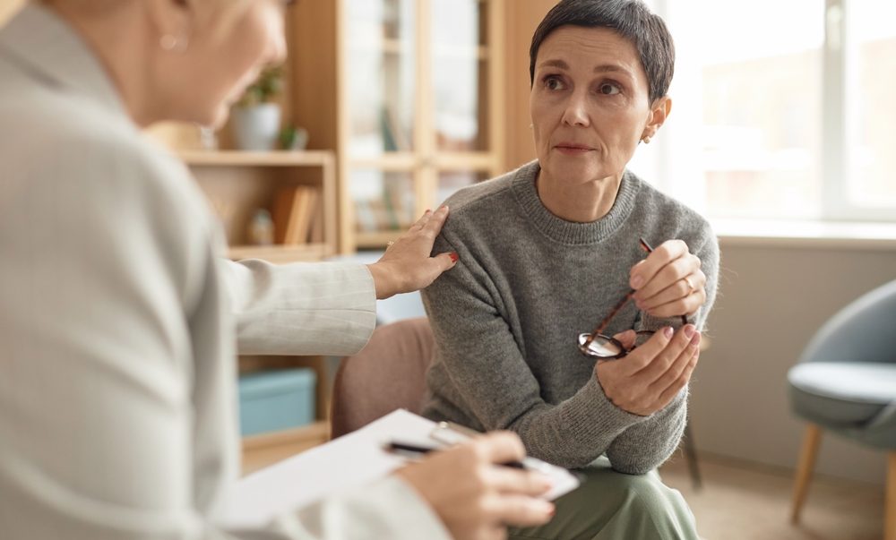 Understanding binge eating disorder 1 A woman holding glasses and looking at another woman