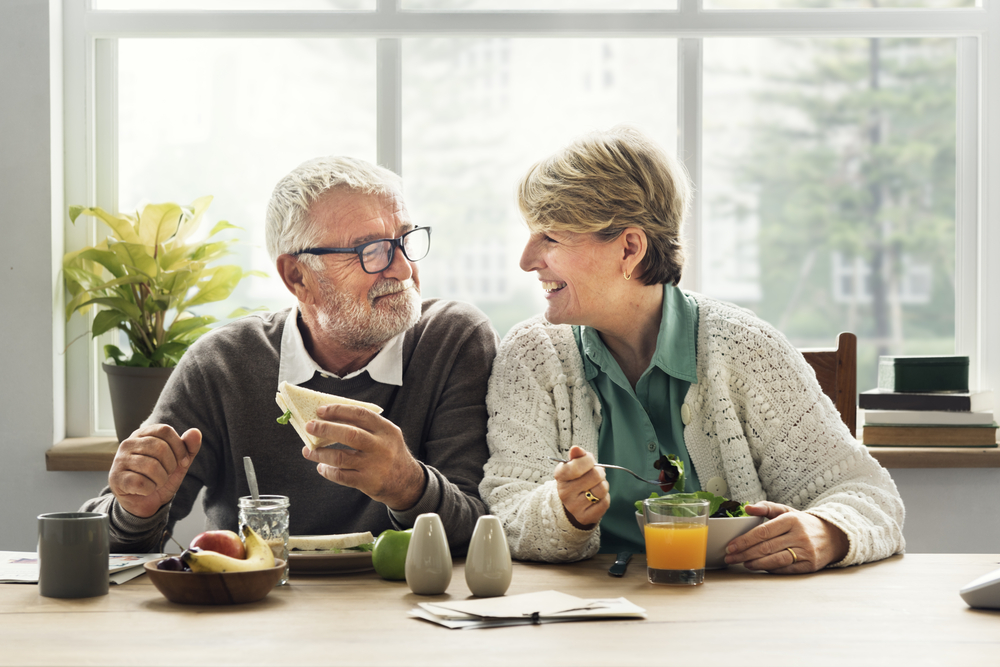 Elderly couple enjoying a meal together - Eating well