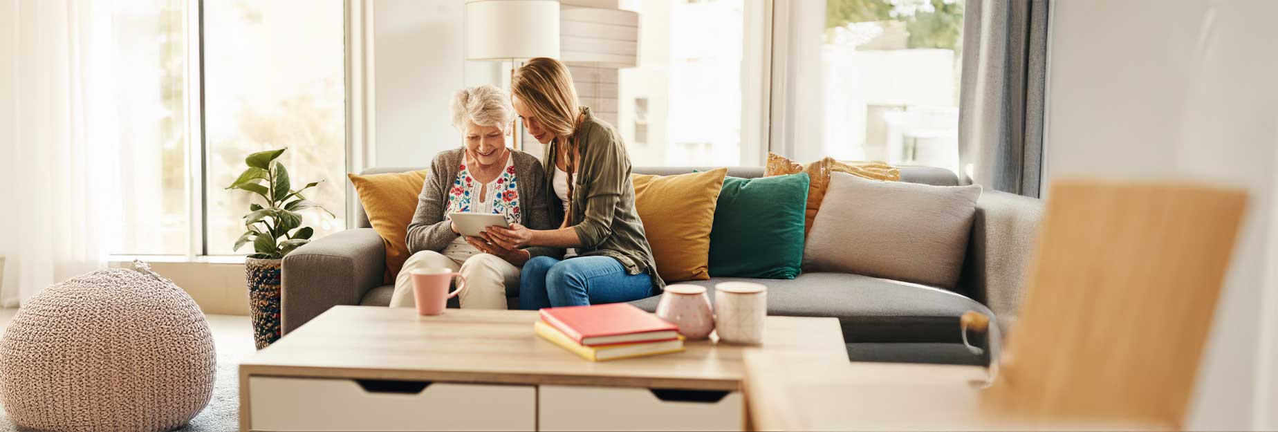 senior and cargiver in their home