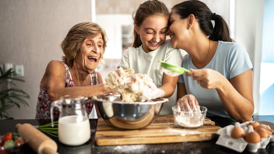 Three Viral Holiday Treats to Make Together This Season 1 Senior, granddaughter and adult daughter baking - Three Viral Holiday Treats to Make Together This Season