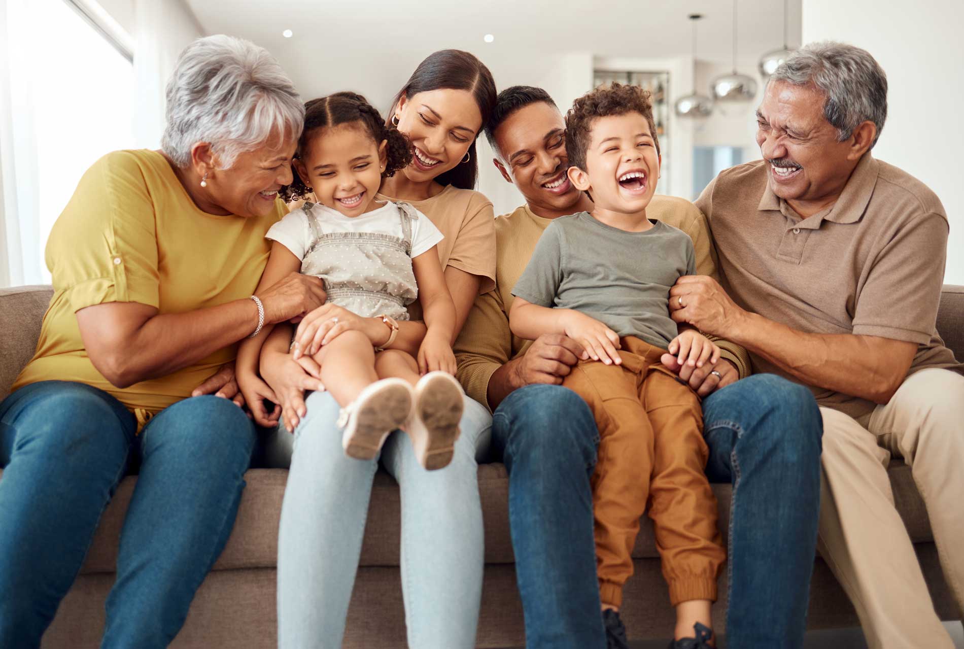 Family sitting together on couch.