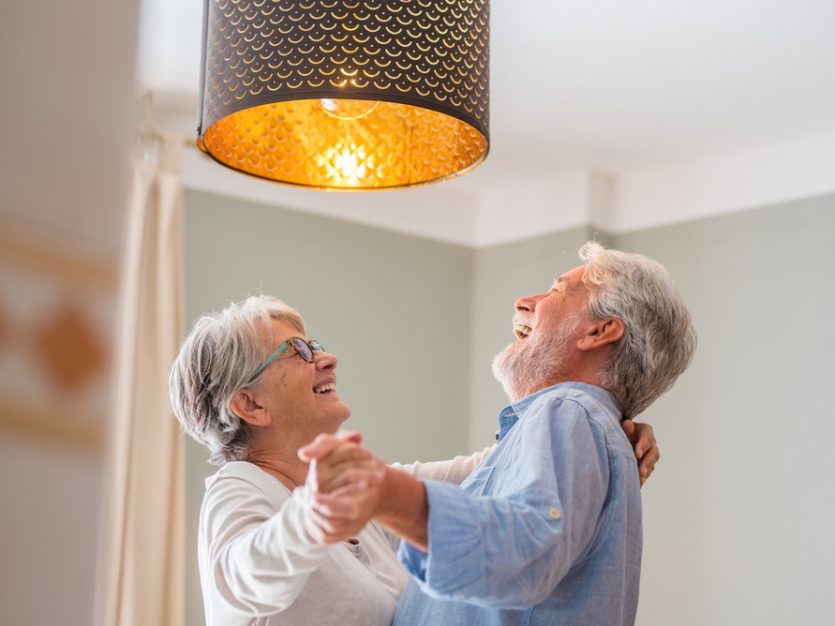Elderly couple dancing indoors together -Moments of Love: Celebrating the Connections That Help Us Age Well