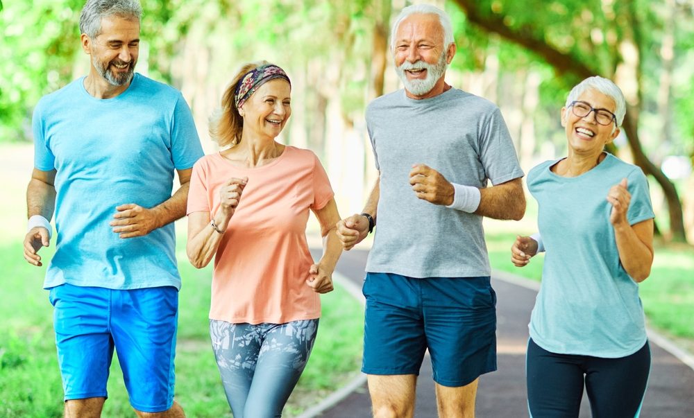 Group of seniors jogging outdoors.