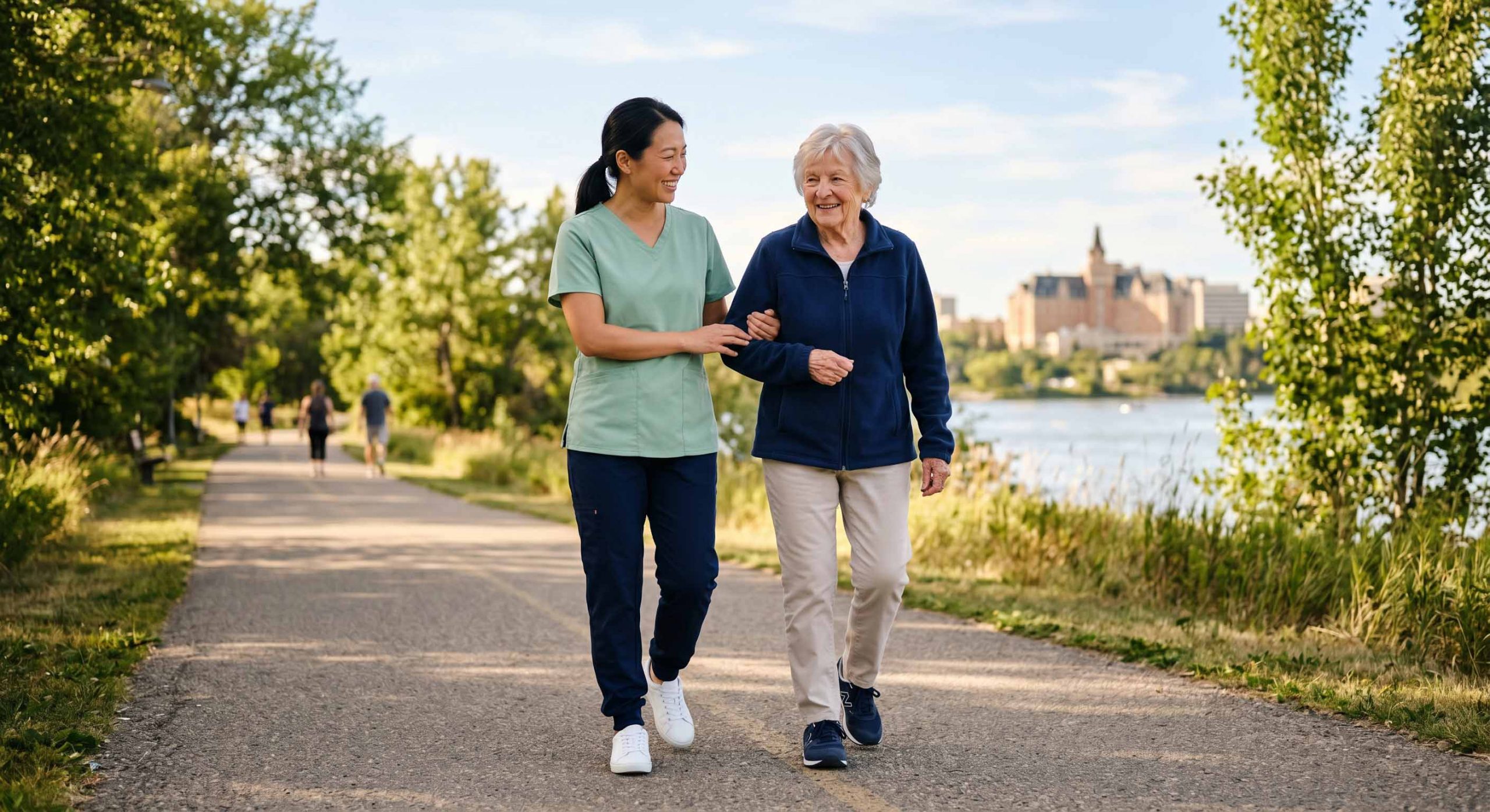 Caregiver and older adult walking on a trail