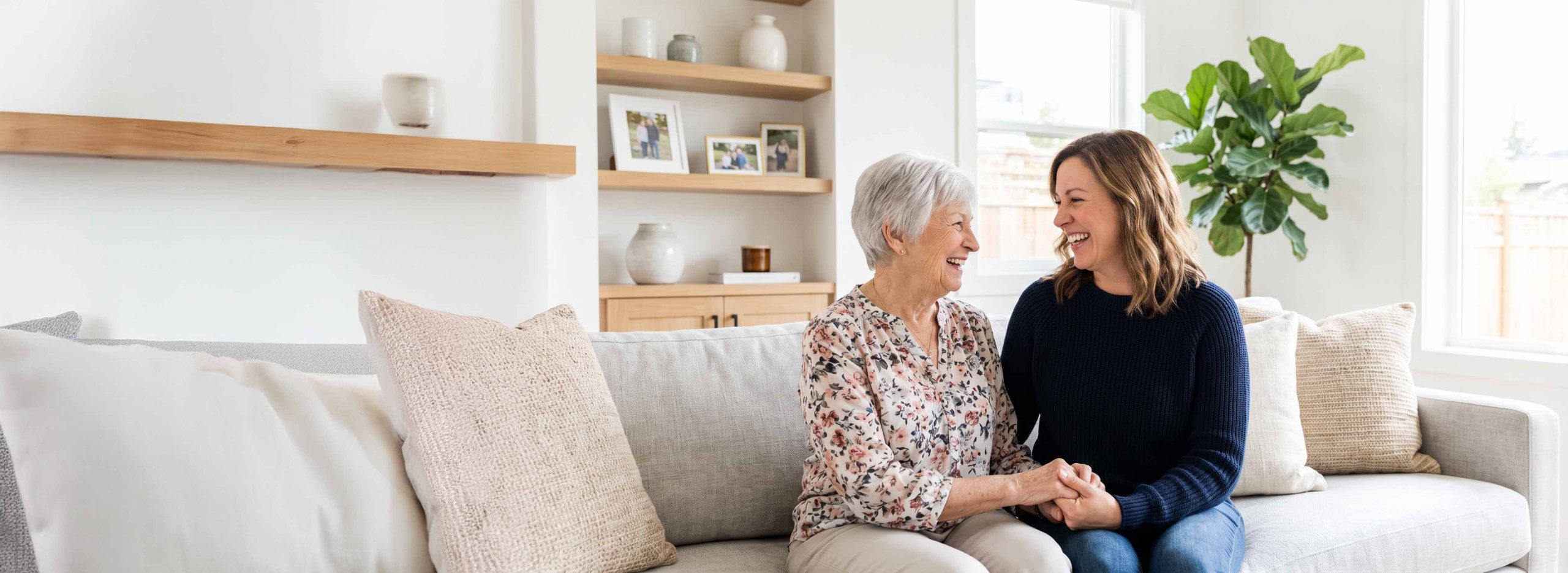 Elderly woman and daughter smiling