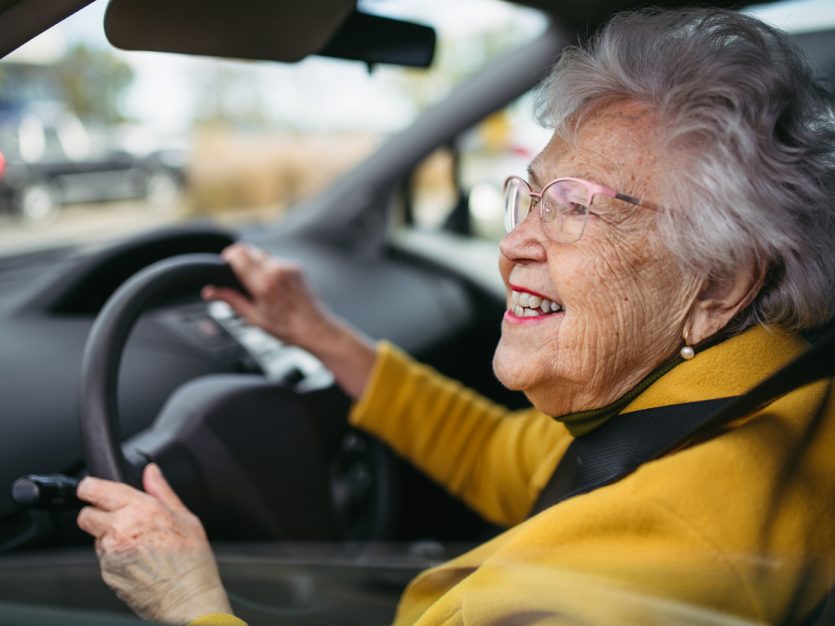 Older adult driving a car.