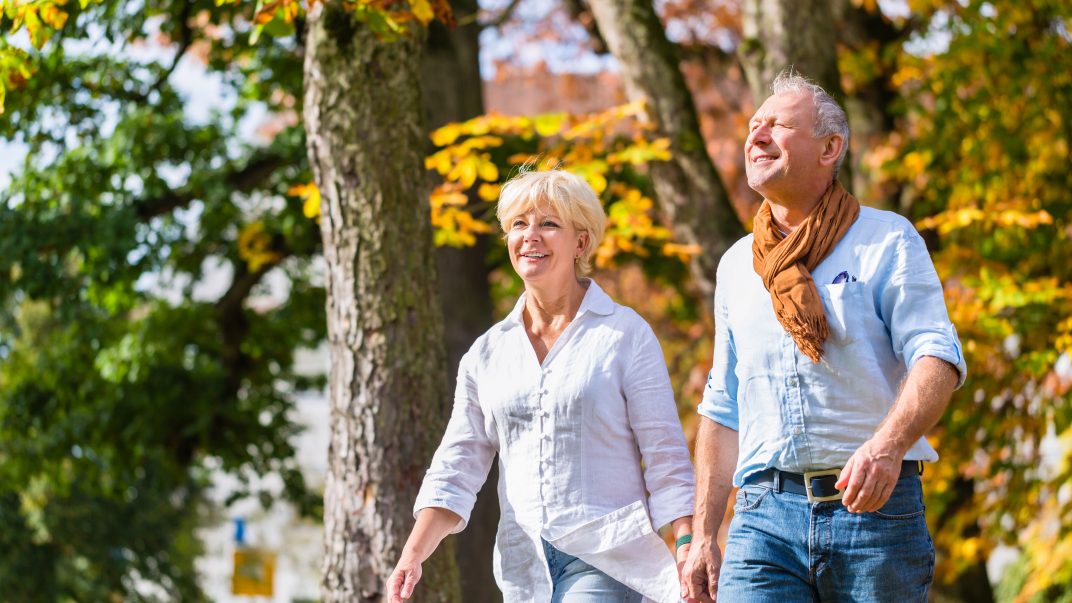 The September reset: Use the end of summer to rebuild the routines that matter 1 Happy elderly couple walking during fall season