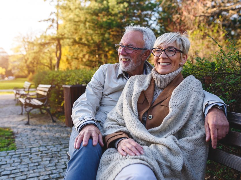 Happy elderly couple enjoying outdoors - Fall Home Prep