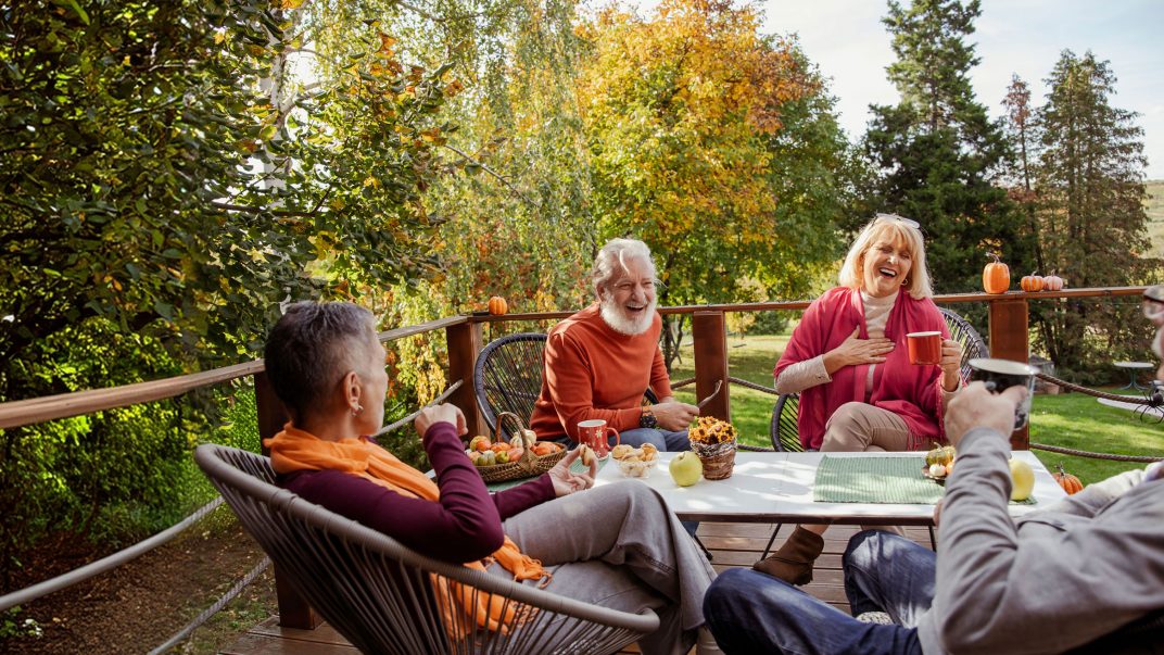 Friends enjoying autumn outdoors together