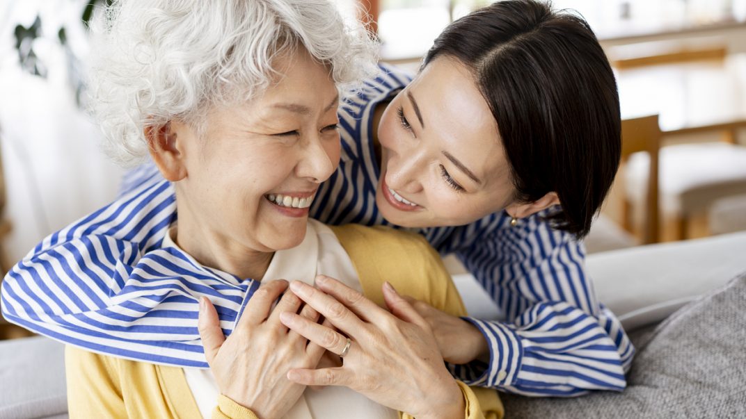 Caring for Aging Parents Without Taking Over: Small Help That Makes a Big Difference 1 Two women sharing a joyful moment - aging parents