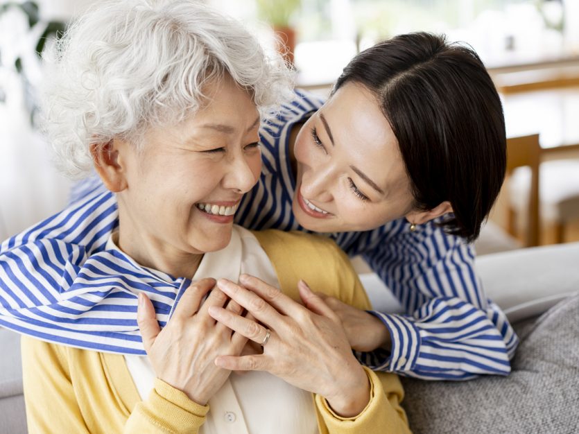 Two women sharing a joyful moment - aging parents