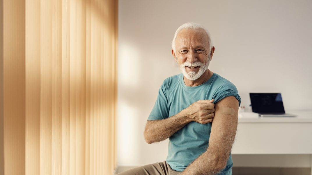 Flu, COVID-19 and RSV: Sorting out your fall vaccine options 1 Smiling elderly man with vaccination bandage
